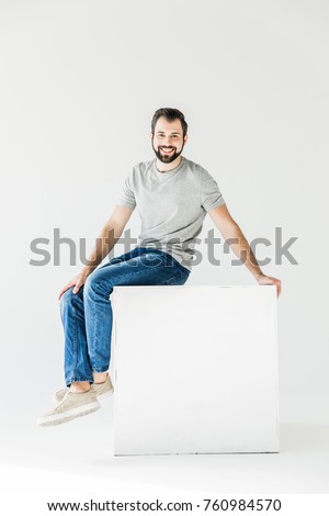 Similar – Image, Stock Photo Man sits on a white horse bridled with a bosal and looks for a carrot in his jacket pocket in thanks for the horse carrying him. In the background are blurred autumn trees.