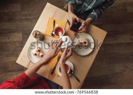 Similar – Image, Stock Photo Crop person pouring tea into bowl with herbs