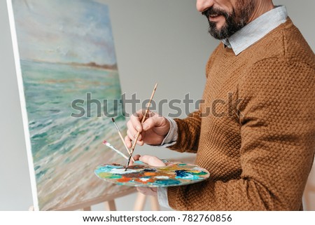 Similar – Image, Stock Photo Crop man painting on studio floor