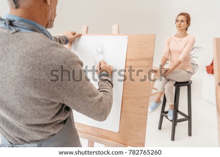 Image, Stock Photo Crop man painting on studio floor