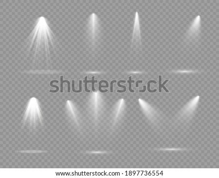 The spotlight shines on the stage. light exclusive use lens flash light effect. light from a lamp or spotlight. lighted scene. podium under the spotlight.