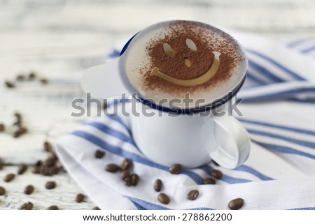home barista coffee top with smiley face in white and blue camping mug