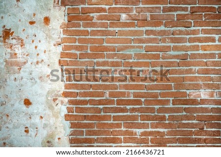 Dilapidated building facade with damaged plaster. Vintage brick wall texture. Background of old stone. Bricks and brickwork. Dilapidated building facade with damaged plaster. Photo stock © 