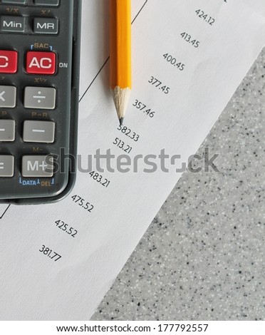 Bank statement with pencil and calculator