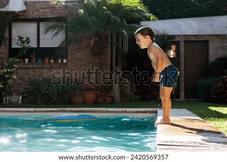 Similar – Image, Stock Photo Boy jumping and splashing in a pool