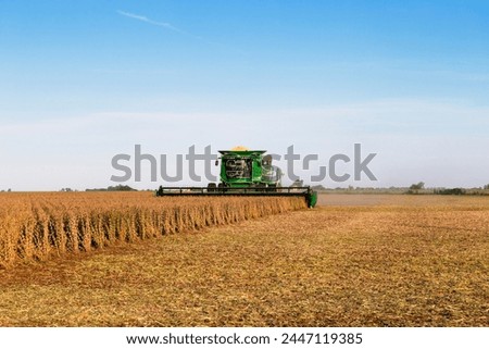 Similar – Image, Stock Photo Combine harvester of an agricultural machine collects ripe golden wheat on the field. Drone Shot. copyspace for your individual text