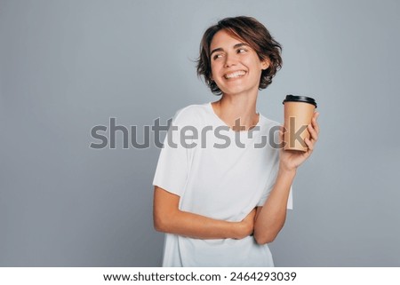 Similar – Image, Stock Photo Woman holding a cup of hot chocolate with marshmallows.