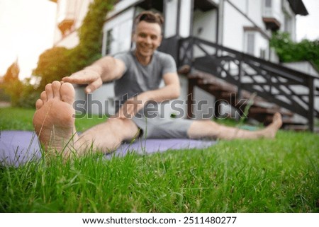 Similar – Image, Stock Photo Sportsman training on backyard and watching tutorial on laptop