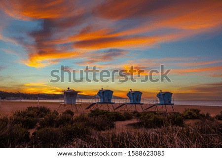 Similar – Image, Stock Photo four lifeguards in yellow hoodies and red pants on the beach