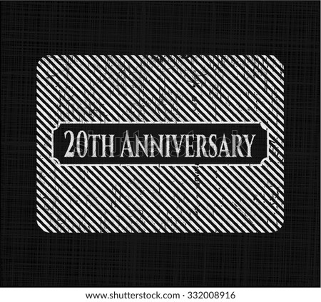 20th Anniversary chalk emblem written on a blackboard