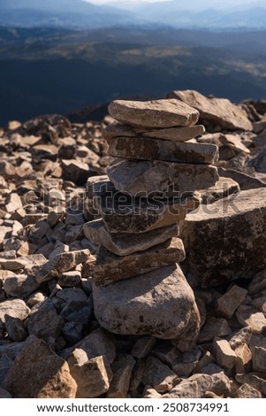 Similar – Foto Bild Von Wasser umgebener steiniger Gipfel in felsigem Tal