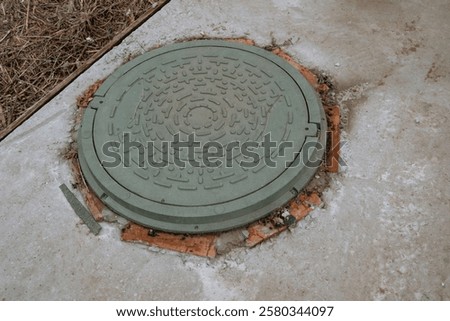 Similar – Image, Stock Photo round manhole cover on rain wet road