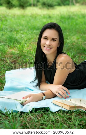 student studying outdoor in park