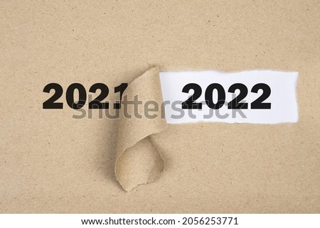 
Message Year 2021 replaced by 2022 torn craft paper texture background.
Good bye 2021 hello to 2022 happy New Year coming concept.