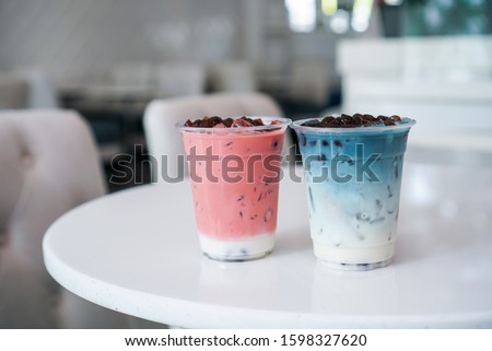 Similar – Image, Stock Photo two plastic cups with liquor stand on a wooden table