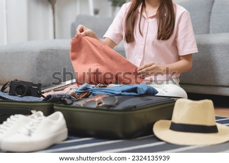 Similar – Image, Stock Photo Close-up of woman packing wooden box with freshly picked vegetebles on field