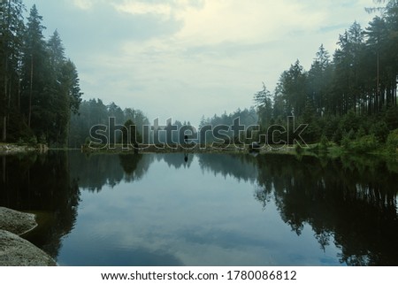 Similar – Image, Stock Photo On the shore of a lake the angler waits for his catch