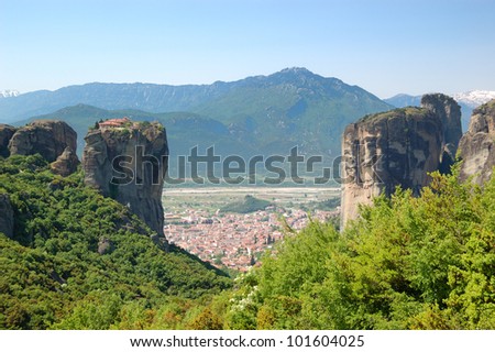 Kalampaka Town between two rocks with  Holy Trinity Monastery on a top, Meteora, Greece