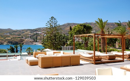 Modern hut and sunbeds at luxury hotel, Crete, Greece