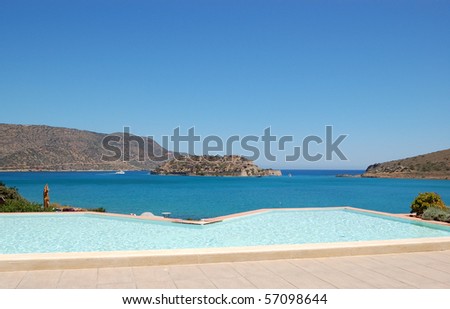 Swimming pool by luxury villa with a view on Spinalonga Island, Crete, Greece