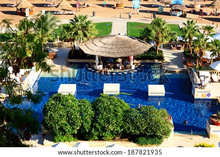 SHARM EL SHEIKH, EGYPT -  DECEMBER 5: The tourists are on vacation at popular hotel on December 5, 2013 in Sharm el Sheikh, Egypt. Up to 12 million tourists have visited Egypt in year 2013.