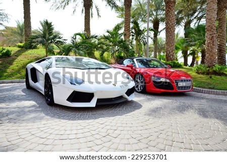DUBAI, UAE - SEPTEMBER 11: The Atlantis the Palm hotel and luxury sport cars. It is located on man-made island Palm Jumeirah on September 11, 2013 in Dubai, United Arab Emirates