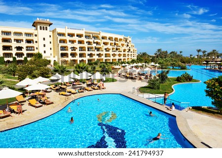 HURGHADA, EGYPT -  DECEMBER 5: The tourists are on vacation at luxury hotel on December 5, 2012 in Hurghada, Egypt. Up to 12 million tourists have visited Egypt in year 2012.
