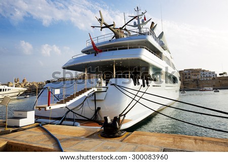 BIRGU, MALTA - APRIL 22: The luxury motor yacht with helicopter on April 22, 2015 in Birgu, Malta. More then 1,6 mln tourists is expected to visit Malta in year 2015.