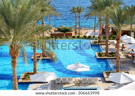 SHARM EL SHEIKH, EGYPT -  DECEMBER 2: The tourists are on vacation at popular hotel on December 2, 2013 in Sharm el Sheikh, Egypt. Up to 12 million tourists have visited Egypt in year 2013.