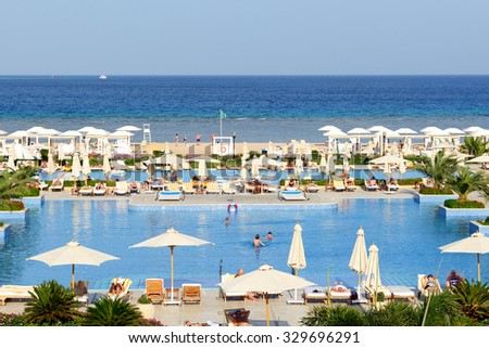 HURGHADA, EGYPT -  DECEMBER 3: The tourists are on vacation at luxury hotel on December 3, 2012 in Hurghada, Egypt. Up to 12 million tourists have visited Egypt in year 2012.