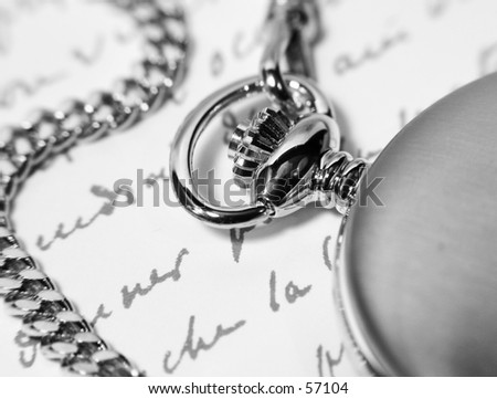 Photo of a Pocket Watch and a Letter In Black and White