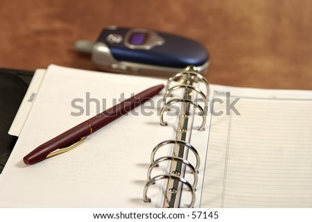 Photo of an Appointment Book and Cell Phone