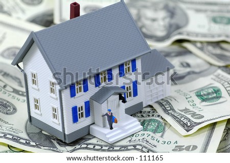 Miniature House on Money.  Part of Series.  See Portfolio For Similar Images