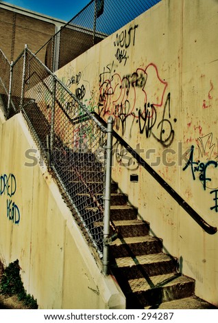 Outdoor Stair Case With Graffiti on the Wall.