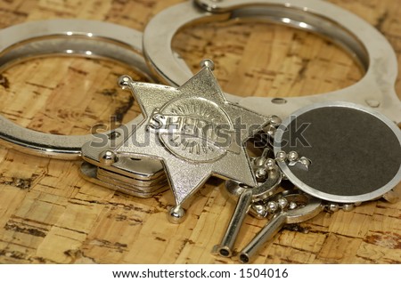 Sheriff\'s Badge and Handcuffs