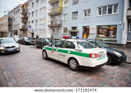 VILNIUS - OCT 28: Lithuanian police patrol vehicle VW Jetta in Vilnius old town on Oct. 28, 2013 in Vilnius, Lithuania. The main policing institution in Lithuania is the Lithuanian Police.