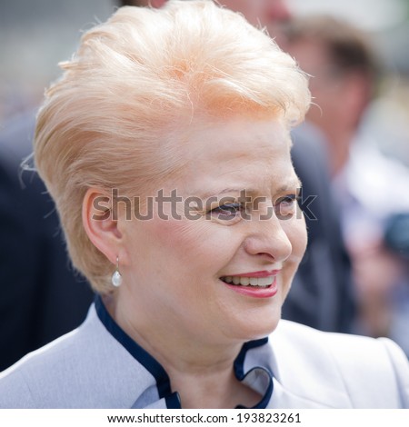 VILNIUS, LITHUANIA - MAY 17: The President of Lithuania Dalia Grybauskaite visiting Public and Military Day Festival held by the White Bridge on May 17, 2014 in Vilnius, Lithuania.