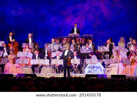 VILNIUS, LITHUANIA- JUN 3: ANDRE RIEU together with his 60-piece Johann Strauss Orchestra performs on stage in Siemens Arena on June 3, 2014 in Vilnius, Lithuania. Andre Rieu is a famous Dutch violinist.