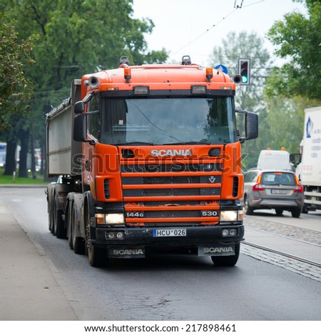 RIGA - SEP 8: Scania 114G V8 530 truck on a road on Sep. 8, 2014 in Riga, Latvia. Scania is a major Swedish automotive manufacturer of commercial vehicles - specifically heavy trucks and buses.