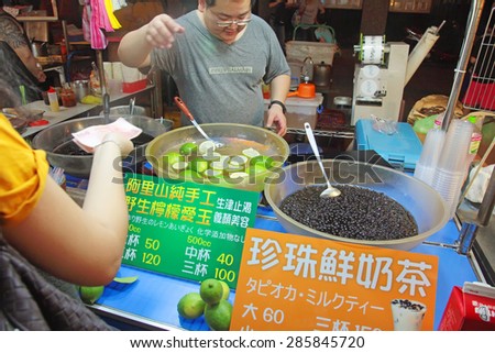 Taipei, Taiwan - May 15th 2015: Raohe Night Market stall selling the most popular Taiwanese drinks, bubble tea and aiyu jelly.