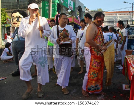 PHUKET, THAILAND - OCTOBER 11: A traditional Mah Song or warrior in the Phuket Vegetarian Street Parade in Phuket Town, Phuket, Thailand on 11th October, 2013.