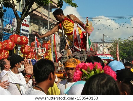 PHUKET, THAILAND - OCTOBER 12: A traditional Mah Song or Warrior in the street procession of The Phuket Vegetarian Festival in Phuket Town, Phuket, Thailand on the 12th October, 2013.