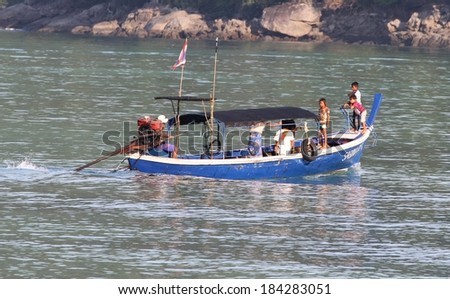 PHANG NGA, THAILAND - MARCH 11: Moken Sea Gypsies in their traditional long tail boat at Mu Ko Surin National Park, Phang Nga, Thailand on the 11th March, 2014.