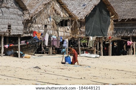 PHANG NGA, THAILAND - MARCH 11: A female Moken sea gypsy going about her daily life on Koh Surin Tai in the Surin Islands National Park, Phang Nga, Thailand on the 11th March, 2014.