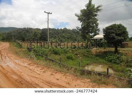The red earth roadway outside of Vang Vieng, Laos.