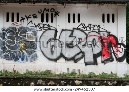 LUANG PRABANG, LAOS - AUGUST 14: A closeup of a  toilet block covered in graffiti in the Unesco town of Luang Prabang, Laos on the 14th August,2014.
