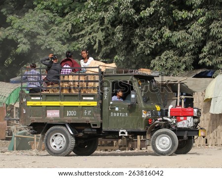 MANDALAY, MYANMAR - NOVEMBER 7:\
An old army truck loaded up with goods and people in the shanty town of Mandalay, Myanmar on the 7th November, 2012.