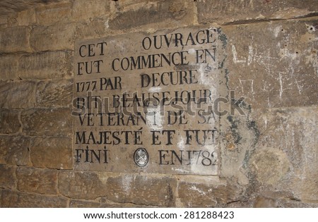 PARIS, FRANCE - APRIL 29: One of the many signs on the walls  in The Catacombs of Paris in Paris, France on the 29th April, 2015.