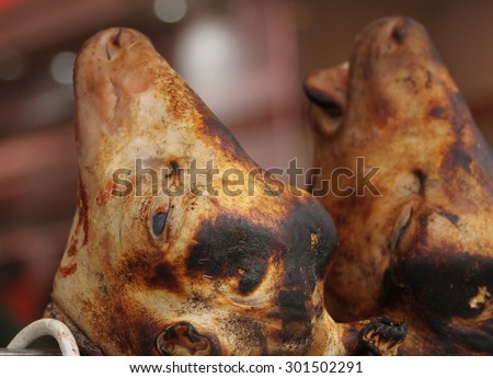 A cow\'s head on display at an open air butcher stall in the 19th Arrondissement of Paris, France.