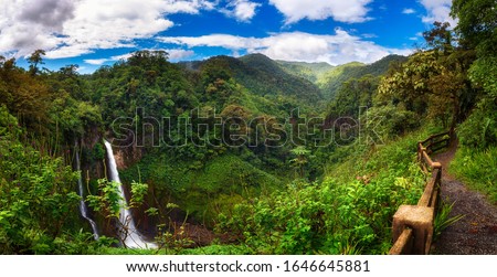 Panorama of the Catarata del Toro waterfall in Costa Rica with surrounding mountains. This waterfall is located in Juan Castro Blanco National Park on the Toro Amarillo River and is 90m high. Stockfoto © 